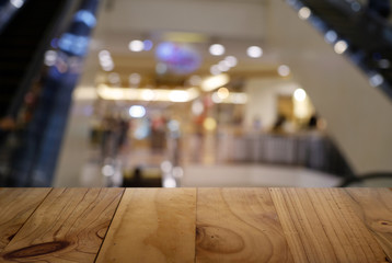 Empty dark wooden table in front of abstract blurred background of cafe and coffee shop interior. can be used for display or montage your products