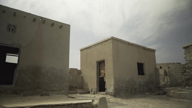 Al Jazirah Al Hamra - Ras al Khaimah Ghost village - FEB 23, 2017: Abandoned empty house with door moving. 