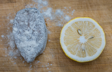 Beautiful lemon on a textured wooden cutting board. Minimalism. Food background