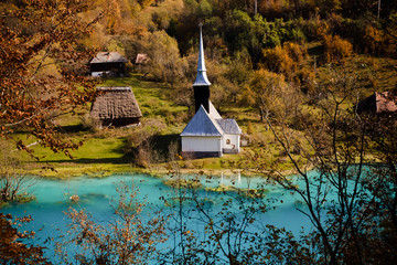 church with its cemetery under contaminated water in Geamana, Romania. Polluted lake with mining...