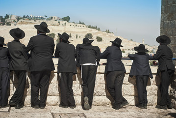 Orthodox Jew students of Yeshivah stand in front of the Western Wall