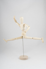 a wooden dummy posing for dance	