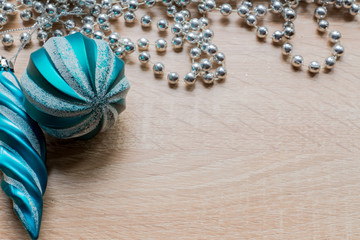 Christmas New Year holiday background. Silver garland and xmas tree decoration toys