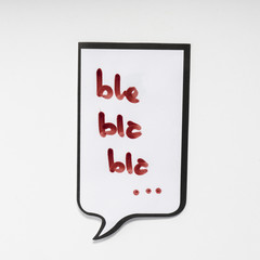 a white memo pad with the shape of a comic with the inscription "bla bla bla"