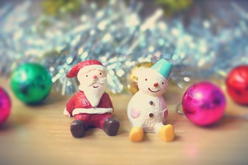 Santa and snowman with Christmas decorations background concept of the coming of cold season and Christmas