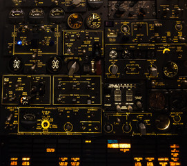 Control levers and switches with backlighting. Airplane cockpit.