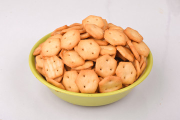 salty & Crispy baked biscuit in green bowl