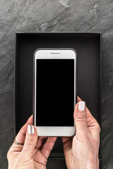Black Friday, box and phone in hands free space