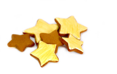 Ginger tasty gingerbread in the form of asterisks, isolated on white background. 
