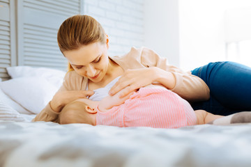 Calm morning of a loving breastfeeding mother