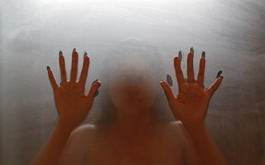Horror woman hands. Diffused silhouette.