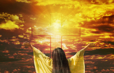 Thank you God, women back or rare view with big crucifix or cross on golden sky