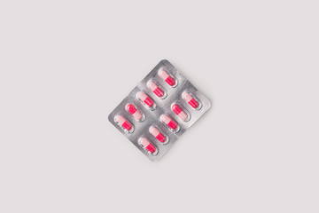 blister pack with red and pink pills