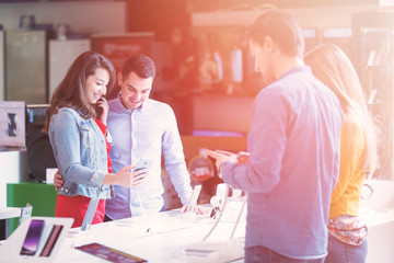 young people shopping for latest phone