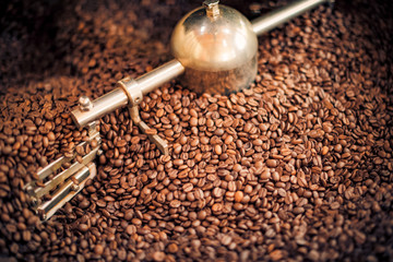 Coffee roasting, fresh coffee beans background