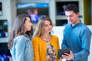 young people buying latest tablet