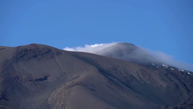 Summit of the volcano, Mount Etna, Sicily, Italy with steam emitting from fumaroles in the summit crater