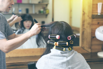 Young asian girl in hair salon.