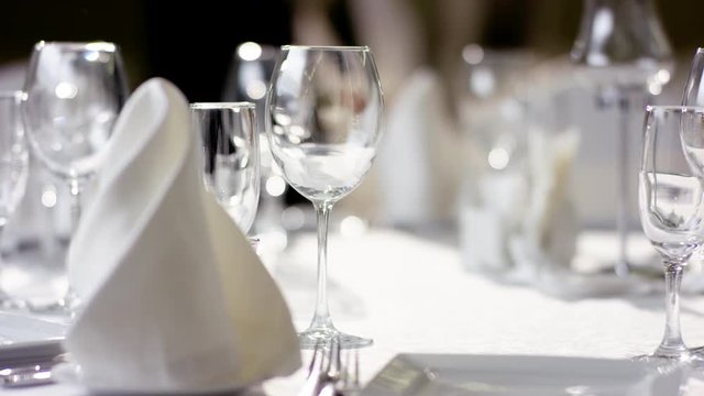 Shot of banquet table and wine glasses at luxury restaurant