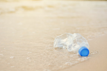 Close-up bottle plastic garbage on the beach