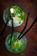 Two Mojito cocktails in glasses