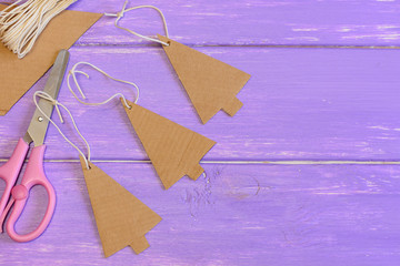Christmas trees decorations made from an old cardboard box. Creative Christmas decor from recycled...