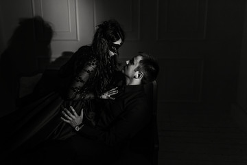 woman  with  theatrical mask and handsome man