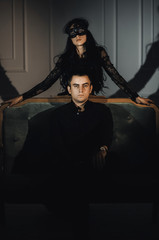 woman  with  theatrical mask and handsome man
