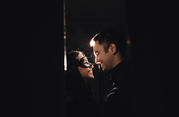 woman  with  theatrical mask and handsome man