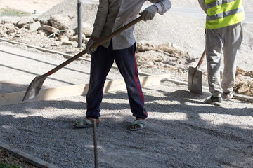 workers dub road sand and gravel