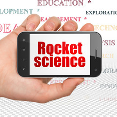 Science concept: Hand Holding Smartphone with  red text Rocket Science on display,  Tag Cloud background, 3D rendering