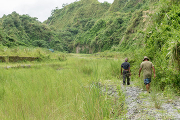 Filipinos walking in Pinatubo mountains