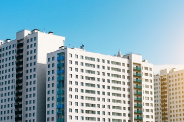 Fototapeta na wymiar Residential houses, identical balconies and windows.