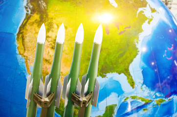 Race of weapons, nuclear weapons, the threat of war in the world. Rockets in the background of...