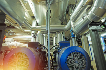 Equipment, cables and piping as found inside of a modern industrial power plant