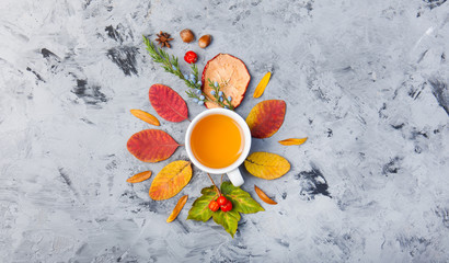 autumn composition cup of tea. autumn leaves on dark background