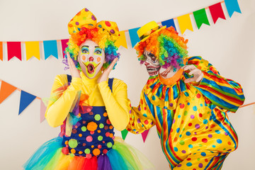 a terrible clown and a good clown. Halloween. The crazy clown and clowness.