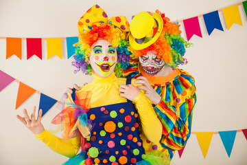 a terrible clown and a good clown. Halloween. The crazy clown and clowness.