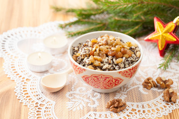 Christmas porridge with a sprig of spruce on a laced napkin