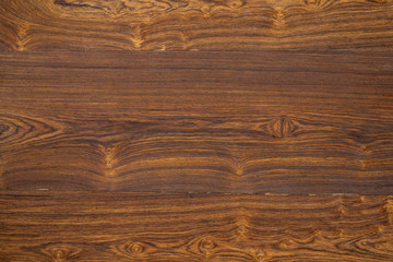 Dark wooden surface of the table