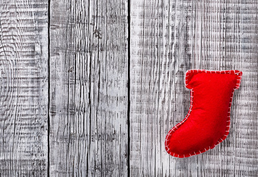 Christmas stocking on rustic wooden background