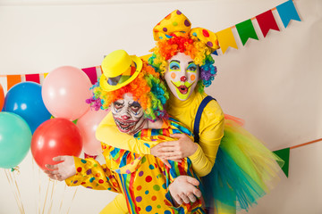 a terrible clown and a good clown. Halloween. The crazy clown and clowness.