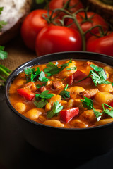 White bean soup with potatoes, tomatoes, paprika, and bacon