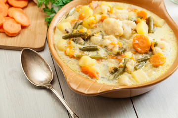 Vegetable soup with ingredients carrot, cauliflower, potato and