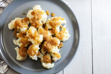 Vegetarian cooked cauliflower with bread crumb