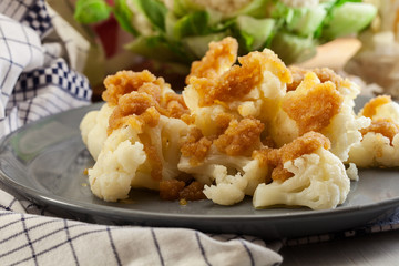 Vegetarian cooked cauliflower with bread crumb