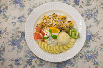 Ice cream and fruit in cafe