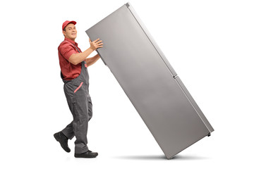 Repairman pushing a refrigerator