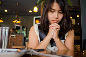 woman praying in morning. Hands folded in prayer