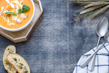 Pumpkin soup frame on the wooden background. Top view. Flat lay. Copy space
